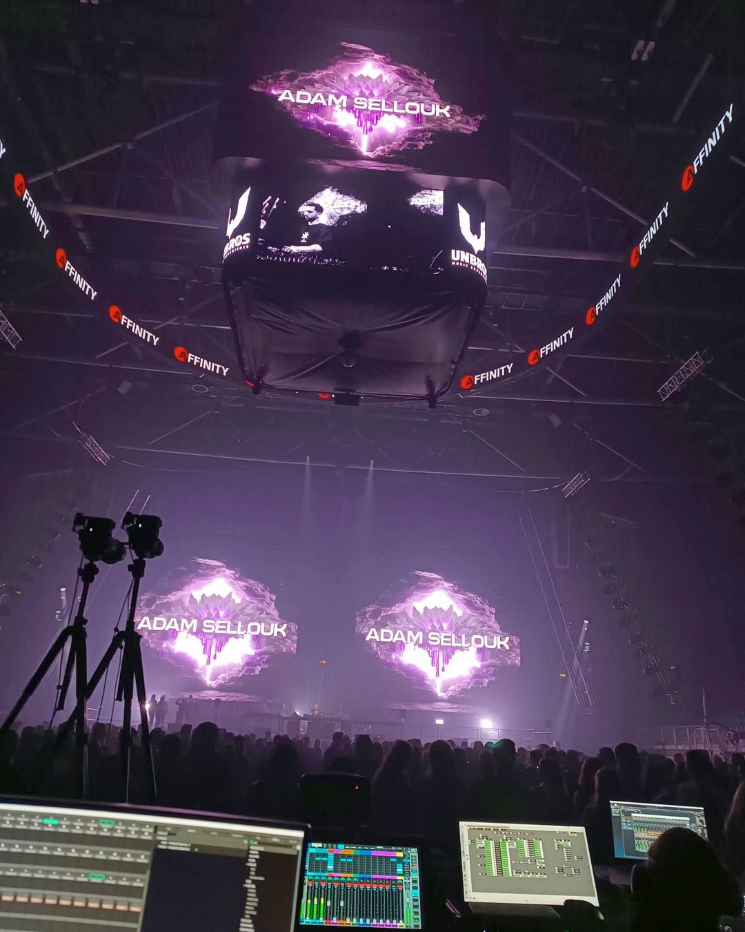 Control desks and LED screens above the arena