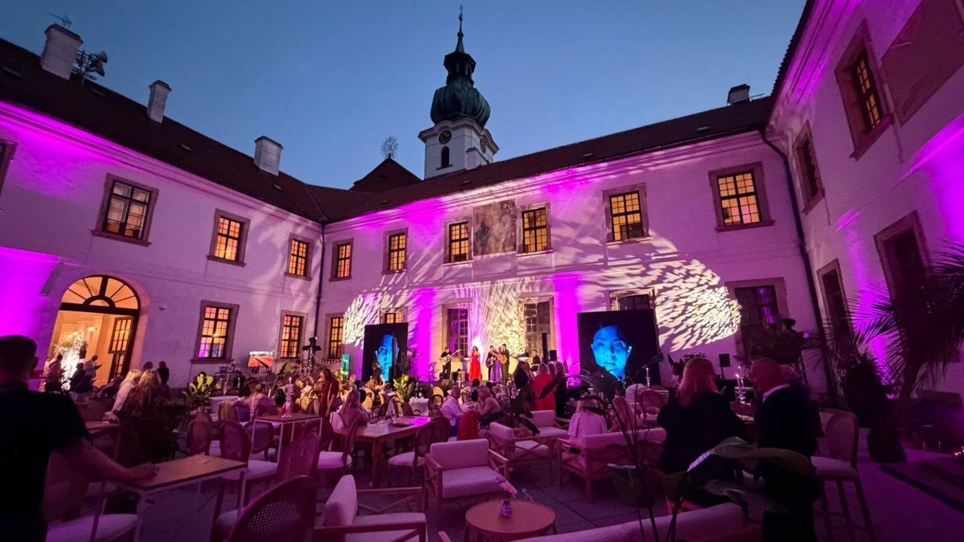 Lit monastery courtyard during a gala evening
