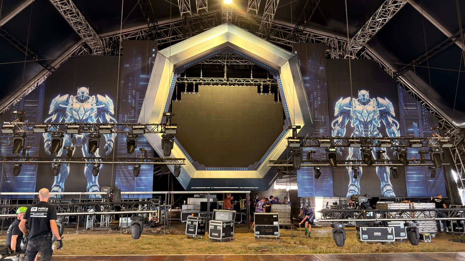 Hexagonal LED portal on a stage in a tent