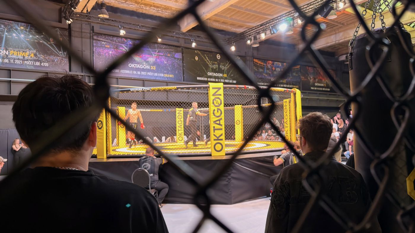 Oktagon cage under lights in a fitness centre hall